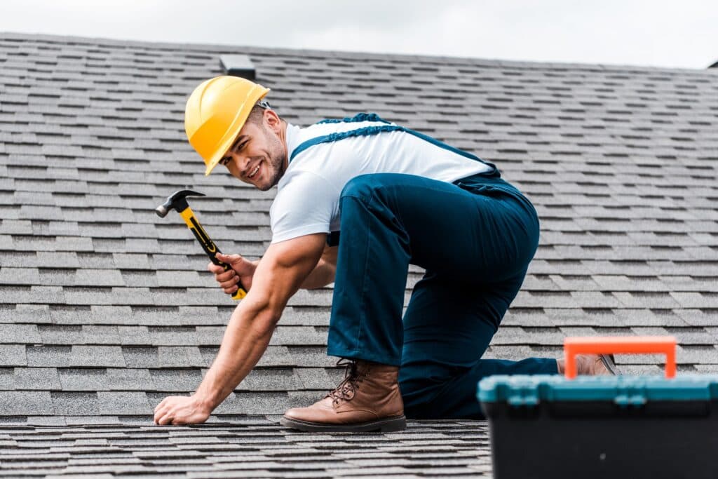 Professional roofer at work in Houston